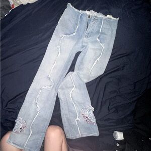 Blue and white flared jeans with a unique design